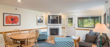 Open floor plan with living and dining area plus lovely gas fireplace