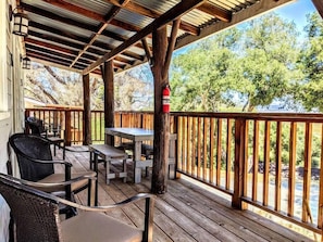 Porch with table and chairs to have a nice meal enjoying the view