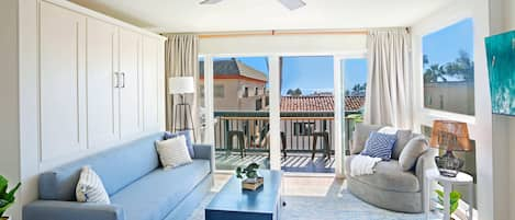 Casa Capistrano Condo 4's living room is full of natural light and extends out onto your own private balcony with an ocean view :)