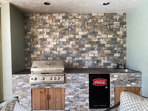 Outdoor tiled kitchen, commercial grill, fridge & sink