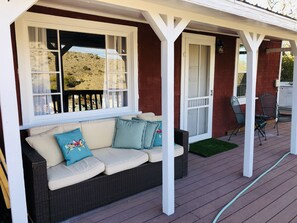 Gorgeous front porch with lots of seating and views for days!