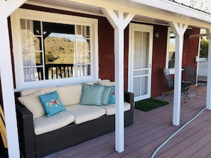 Gorgeous front porch with lots of seating and views for days!