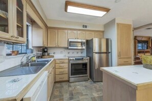 The kitchen at Larkspur Lodge is fully stocked and ready for your family feasts! Enjoy modern appliances, cookware, pots, pans, dishes, silverware, and all the essentials you need to prepare and serve delicious home-cooked meals with ease. 