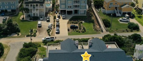 Drone view of Summer Breeze facing the ocean and walkway (old color - now blue) 