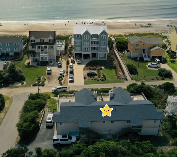 Drone view of Summer Breeze facing the ocean and walkway (old color - now blue) 