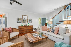 Upon entering the main house, you are welcomed by a beautifully furnished living room.