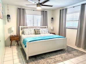 The master suite has a comfy King bed a full bathroom and a walk-in closet.