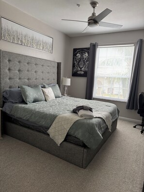 Master master king size bed, modernly designed with walk-in closet /bathroom.