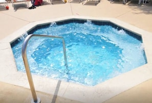 Hot tub next to pool