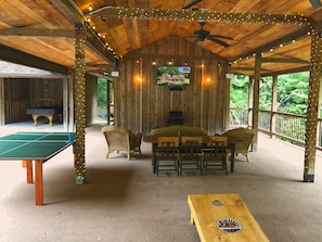 Outdoor gaming and entertainment. Pool table, ping pong, TV with surround sound.