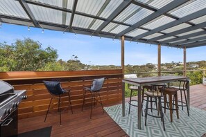 Built-in bar with ocean and park view.