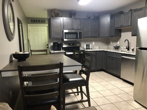 Kitchen, renovated, wood cabinets, Granite, Stainless Steel appliances and tile