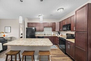 The kitchen offers plenty of storage and counter space as well as your standard appliances.