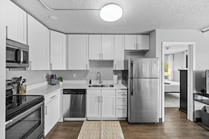 The kitchen is open, spacious and stocked with everything you might need during your stay.