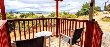 Porch with chairs facing an amazing view of the valley