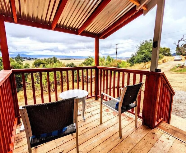 Porch with chairs facing an amazing view of the valley