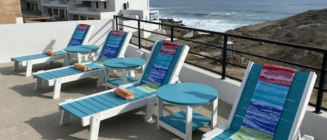 Lounge in the patio chairs while listening to the Pacific waves crashing!
