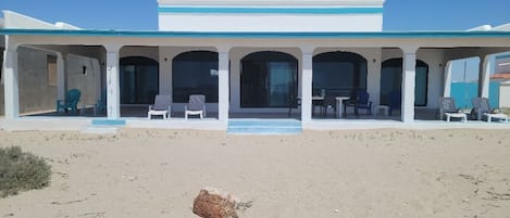 Beachfront patio. Cool ocean breezes. Step off you patio onto the sandy beach