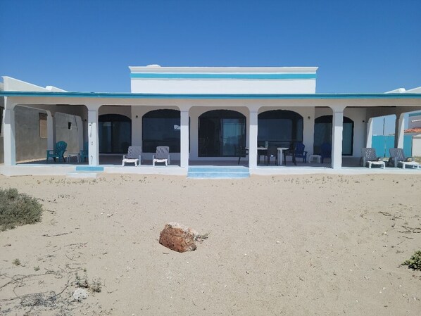 Beachfront patio. Cool ocean breezes. Step off you patio onto the sandy beach