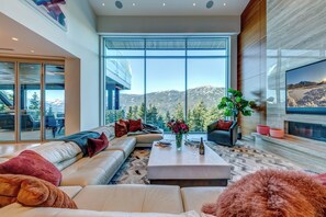 Large open concept living room with amazing valley views and gas fireplace