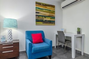 A corner sofa next to the small desk