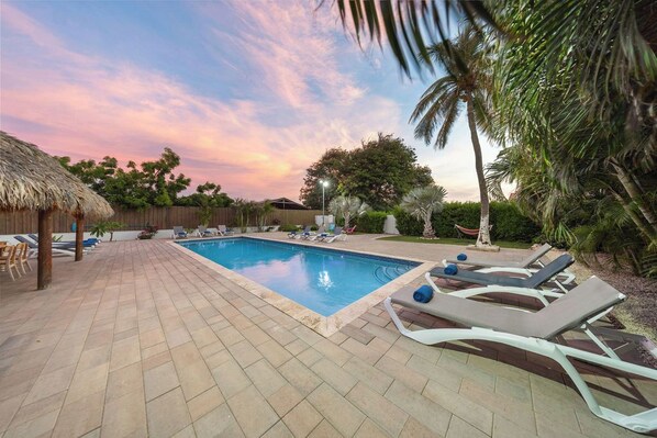 Dive into relaxation at our poolside oasis, featuring stylish sun loungers and a serene atmosphere