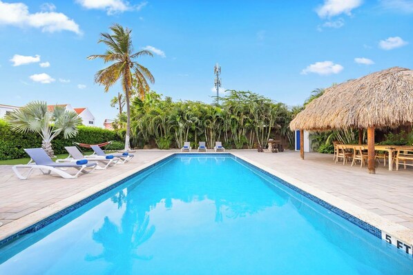 Dive into luxury in our refreshing, expansive pool. Experience ultimate relaxation and elegance.