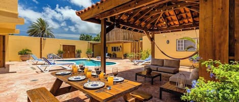 Picnic Table and Outside Patio with hammock.