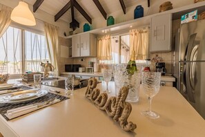 There is a large fridge with plenty of space, a microwave oven, a dishwasher, a blender, a kettle, a toaster, an Italian Moka for cafes, all sizes of pans, serving dishes for 8 people, spices and all kitchen utensils, and much more.