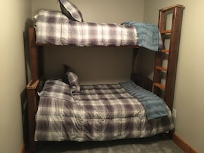 Bedroom 2 bunk bed with double bed on bottom and twin bed on top.