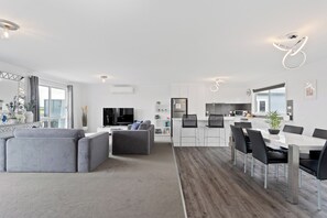 Upstairs open plan living, dining and kitchen area with pool table