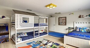 Toy Story-themed kids' room with fun bunk beds, arcade, and cozy adventure vibes.