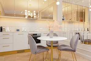 Modern, chic and fully equipped kitchenette with dining area.