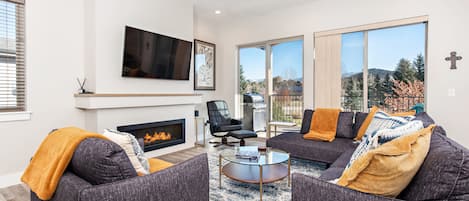 Living room with SmartTV and balcony access