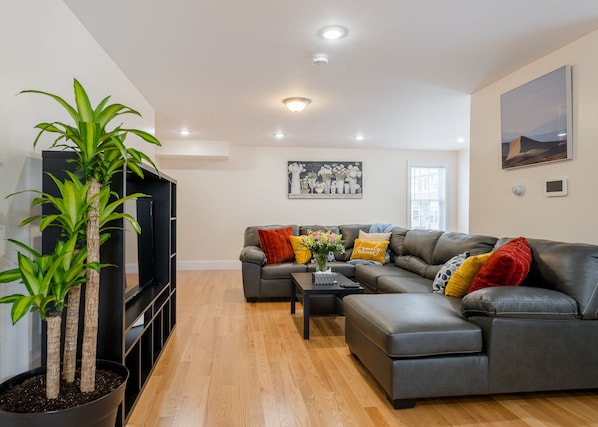 Living room connecting with dining and kitchen.