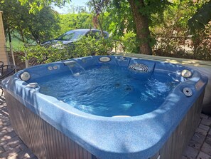 Relax in the 4-person hot tub (shared with the other 2 units in this complex)