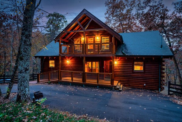 Front view of the cabin at sunset with no neighbors and lots of parking.