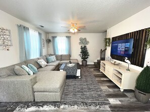 Family Room - Sectional Sofa, family games, and 50" Smart TV