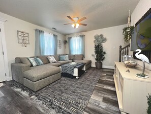 Family Room - Sectional Sofa, family games, and 50" Smart TV