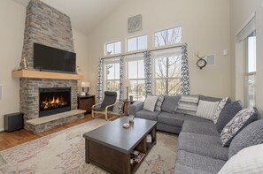 Floor to ceiling gas fireplace makes for cozy winter evenings