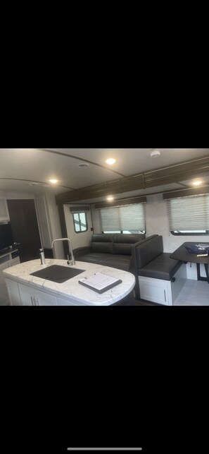 Sofa sleeper and table are additional sleeping areas