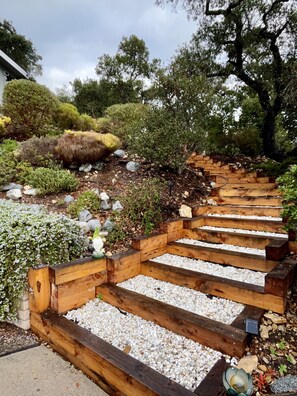 Take the beautiful garden stairs  to your space. It’s hard to miss the Gnome 😊