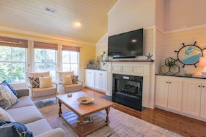 Deja Blue is a spacious yet comfortable beach home with stunning hardwood floors, vaulted ceilings and shiplap walls.