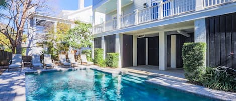 Deja Blue has a private pool and patio in its backyard.