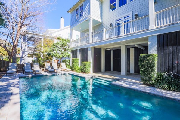 Deja Blue has a private pool and patio in its backyard.