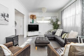 Lounge with 55inch Smart TV with Netflix, Disney and YouTube & dvd player.