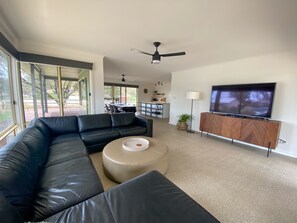 65" TV with blu-ray player. Sliding doors on both sides for the breeze.