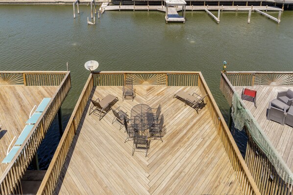 Large deck with lounge chairs for you and your guests to enjoy
