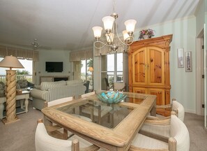 Dining Area with Newly Upholstered Chairs Offers Ocean Views and Opens to Living Room and Kitchen