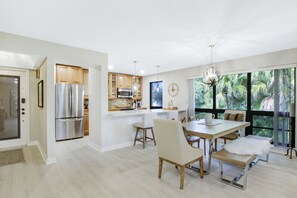 Dining area alongside barstool seating at the kitchen counter